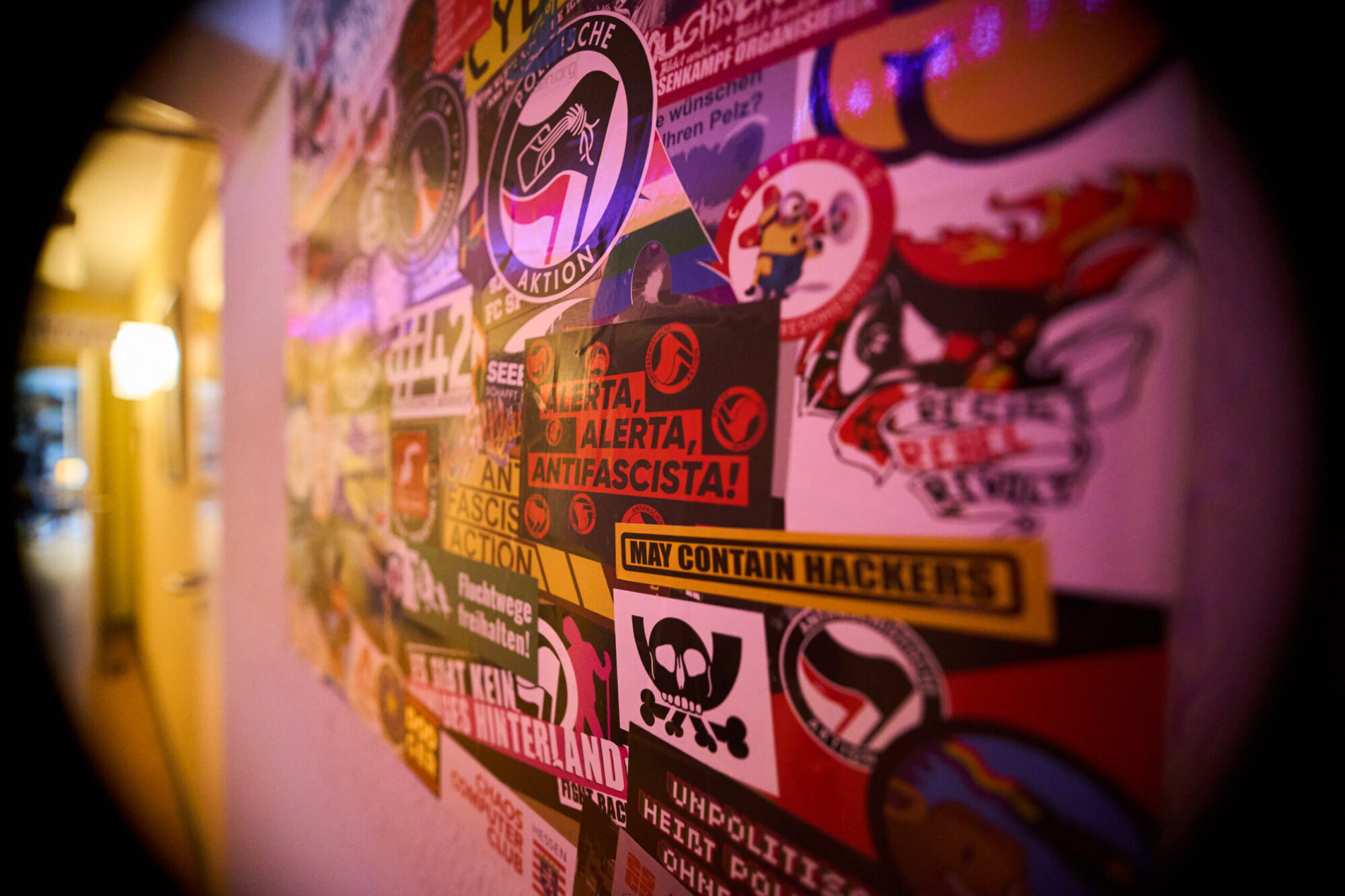 Stickers on a sticker wall, with "Alerta Alerta Antifascista!" in the middle.